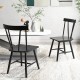 Two Windsor style armless chairs in black with solid rubber wood frames, perfect for dining or living room use.