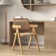 Single rattan accent chair with natural bamboo frame, showcasing a wide sitting area and mid-century design for.