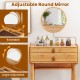Adjustable round mirror on bamboo makeup vanity table with two storage drawers for easy access to cosmetics.