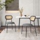 Set of 2 gray rattan dining chairs with metal legs, featuring ergonomic backrests and padded seats for comfort.