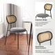 Rattan dining chair with ergonomic design, padded seat, and metal legs, perfect for modern dining areas.