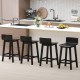 Set of four black wood bar stools with solid back and seat, ideal for kitchen counters and dining areas.