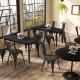 Tolix style stackable metal dining chairs with wood seat, featuring ergonomic design for cafes and homes.