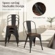 Stackable black metal dining chairs with wood seats, featuring ergonomic design and anti-scratch pads for easy storage.