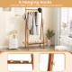 Bamboo clothes rack with 5 copper hooks and rattan shelf, ideal for organizing coats, hats, and shoes in any room.