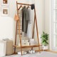 Bamboo clothes rack showcasing a rattan shelf and multiple hooks, providing stylish storage for hats and bags in any.