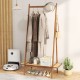 Bamboo clothes rack with hanging rod, rattan shelf, and copper hooks, perfect for organizing entryway or bedroom items.