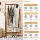 Bamboo clothes rack with strong hanging rod, rattan shelf, and copper hooks for organized entryway storage.