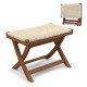 Folding natural rattan ottoman with hand-woven seat, crafted from teak wood, ideal for space-saving seating.