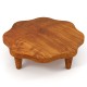 Flower-shaped 16" teak wood pedestal stand with four feet, perfect for displaying snacks or decor indoors and outdoors.