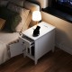White flip top end table with a drawer and charging station, featuring a sleek design for bedside or living room.