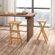 Set of 2 folding outdoor bar stools with ergonomic teak wood seats and stable x-shaped frames for easy storage.