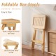 Folding bar stool with ergonomic saddle seat, crafted from teak wood, easy to store, perfect for outdoor use.