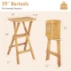 Set of 2 folding outdoor bar stools in teak wood with ergonomic saddle seat and x-shaped frame for stability.