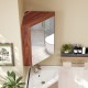 Corner medicine cabinet with mirror door in brown, featuring adjustable shelf and soft close hinges for space-saving.