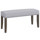 Gray upholstered entryway bench featuring nailhead trim and strong rubber wood legs, perfect for end-of-bed use and.