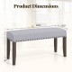 Gray upholstered entryway bench measuring 42.5" x 15.5", featuring nailhead trim and strong rubber wood legs.