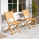 Two teak wood outdoor dining chairs with slatted seats, perfect for patio or garden relaxation.