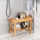 Teak shower stool with storage shelf, non-slip footpads, and ergonomic curved seat for bathroom organization.