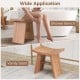 Teak wood shower bench with curved seat, ideal for bathroom use, featuring sturdy construction and drainage gap.