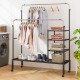 Rolling double rods garment rack in silver with adjustable bars and storage shelves, ideal for laundry or bedroom use.