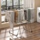 Folding 2-tier laundry drying rack with aluminum frame, featuring adjustable wings and shoe rack for efficient drying.