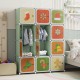 Colorful 12 cube kids wardrobe closet in green with cartoon patterns, featuring hanging section for versatile storage.