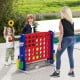 Jumbo 4-to-score game in red with ring toss and basketball hoop, perfect for outdoor family fun and adjustable heights.