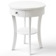 Round white end table with open drawer and shelf, made of MDF, perfect as a bedside or snack table.