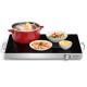 Electric warming tray with adjustable temperature, featuring a glass top and stainless steel base, ideal for buffets.
