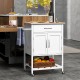 Rolling kitchen island cart in white with rubber wood countertop, drawer, towel rack, and storage for kitchen supplies.