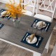 Dark gray 47-inch dining table set for four, featuring a smooth surface and stylish decor, perfect for small spaces.