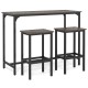 Counter-height dining table with two bar stools in gray, perfect for small spaces and versatile use.
