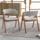 Set of 2 walnut and grey accent armchairs with curved backrest, perfect for dining rooms and modern interiors.
