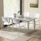 Modern dining table set featuring four white chairs with tilted backrests and sturdy metal legs, perfect for stylish.