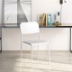 Modern white dining chair with tilted backrest and sturdy metal legs, ideal for stylish indoor or outdoor dining.