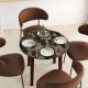 Round dining table featuring a marble-textured veneer surface and brown rubber wood legs, ideal for elegant dining.