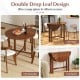 Dual drop leaf dining table in walnut finish, fully expanded, showcasing its versatile design for small spaces.