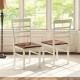 Two white PU leather upholstered dining chairs with curved backrests, perfect for home or restaurant use.