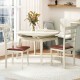 White PU leather upholstered armless dining chairs with curved backrests, perfect for stylish dining areas or cafes.