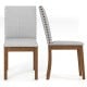 Upholstered dining chair set with padded seat, walnut frame, and decorative nailhead trim for elegant living room decor.