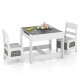 Kids table and chairs set in white with storage boxes and a dual-function blackboard for drawing and writing.