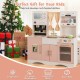 Kids kitchen playset in pink featuring a microwave, coffee maker, and double stoves for imaginative play and skill.