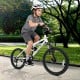 Child riding a white 20-inch mountain bike with adjustable saddle, dual V-brakes, and large pneumatic tires for smooth.
