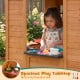 Spacious play tabletop with toy faucet and sink in a wooden playhouse, perfect for kids' pretend cooking fun.
