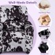 Kids recliner chair with cow print, high-density foam, solid wood frame, and cup holder for comfortable lounging.