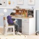 Natural study desk and chair set with a child reading, perfect for homework and creative activities in a kids' room.