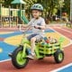 Kids tricycle in green with 15-inch inflatable rubber tires, featuring a storage basket for toys and adjustable seat.