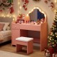 Kids vanity desk in pink with lighted mirror, adjustable shelf, and matching stool for pretend play and dressing up.