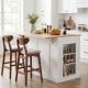Kitchen island with storage and adjustable shelves in white, featuring a drop leaf design and solid rubber wood.